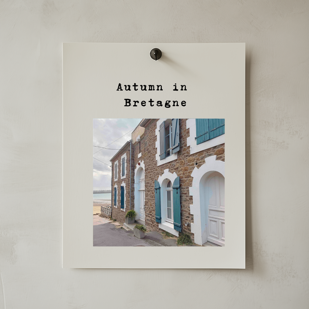 Pinned editorial cover showing a Brittany stone house with pale blue shutters
